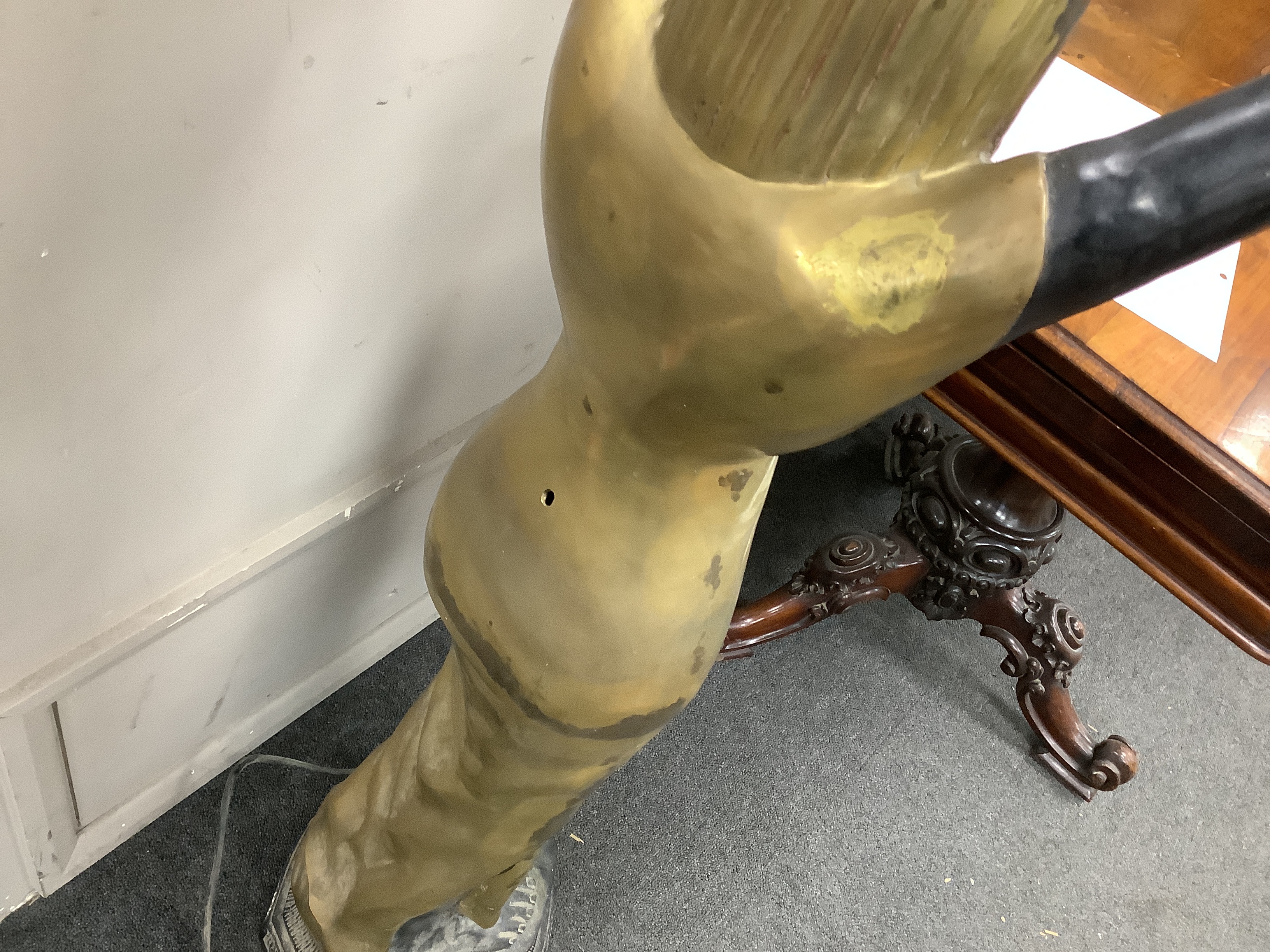 A pair of Egyptian Art Deco style painted metal floor lamps with opaque flambé shades, height 142cm